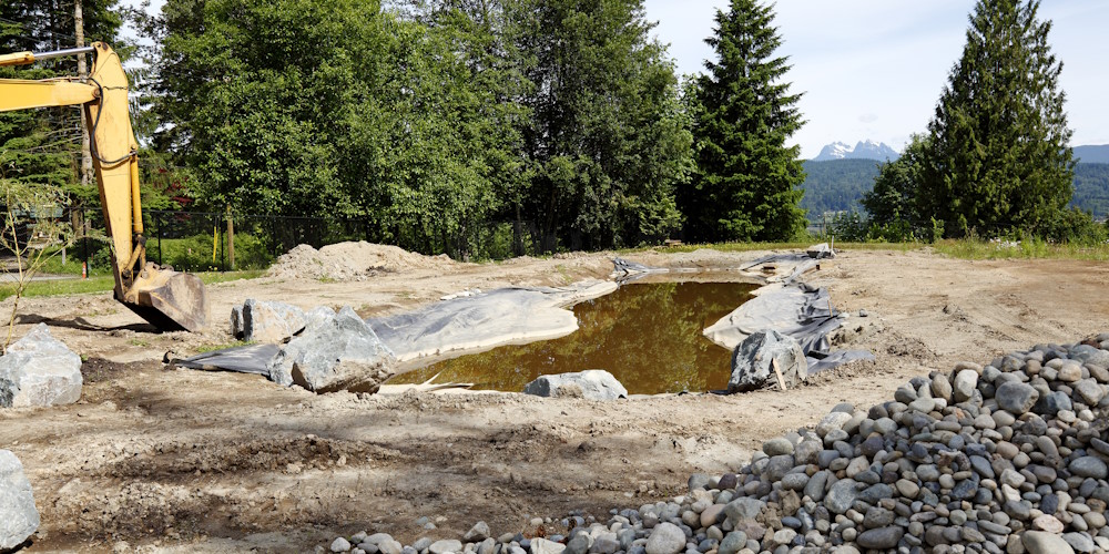 Excavator Digging Pond